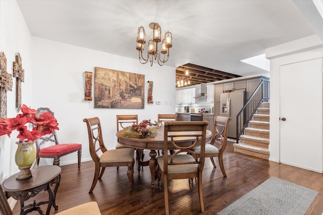 dining room featuring dark wood-style flooring, stairway, baseboards, and an inviting chandelier