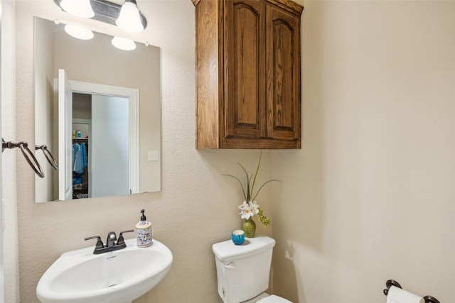 bathroom with a sink and toilet