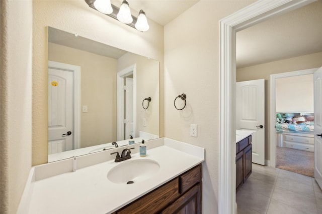 bathroom with tile patterned flooring and vanity