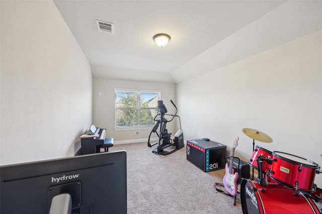 workout area with lofted ceiling, carpet floors, visible vents, and baseboards