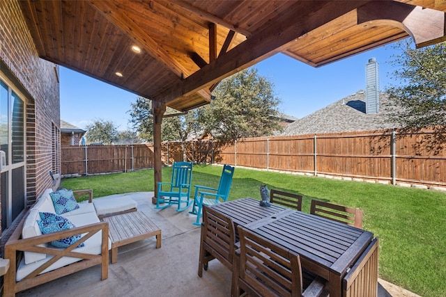 view of patio with outdoor dining space and a fenced backyard