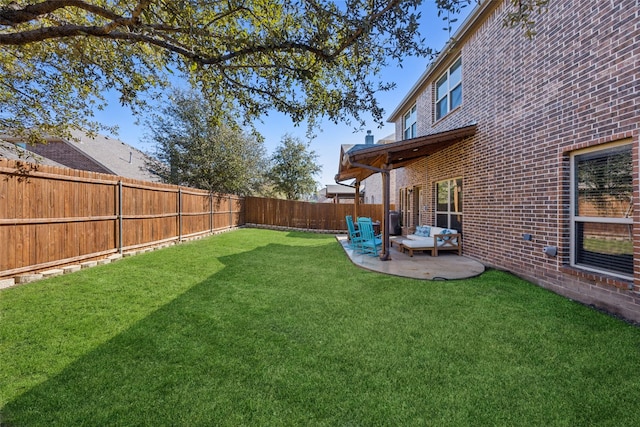 view of yard with a fenced backyard and a patio