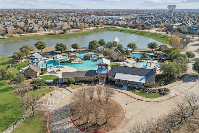 bird's eye view featuring a water view and a residential view