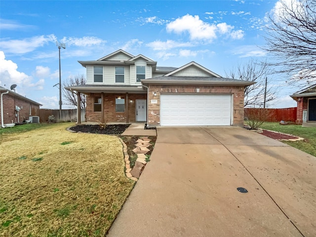 traditional-style home featuring a garage, concrete driveway, a front yard, and fence