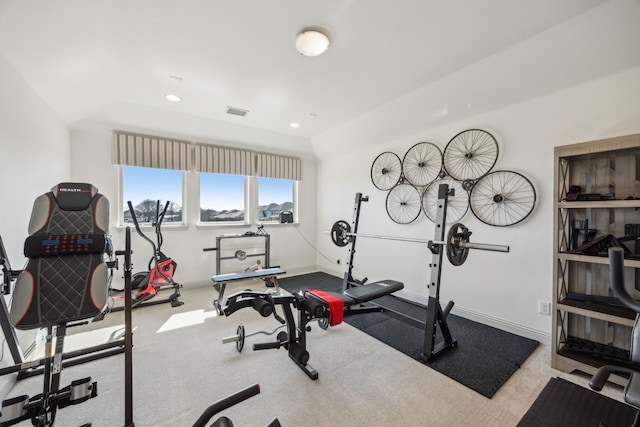 exercise area with lofted ceiling, recessed lighting, light colored carpet, and baseboards