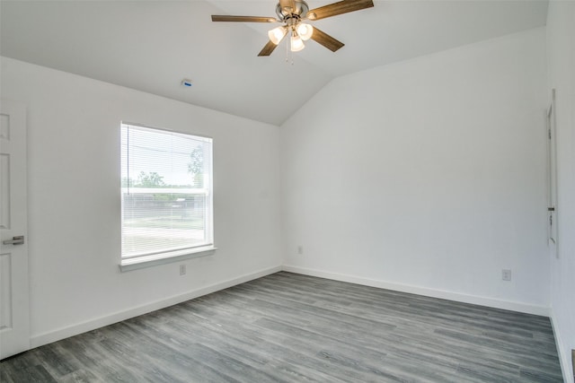 unfurnished room featuring lofted ceiling, ceiling fan, baseboards, and wood finished floors