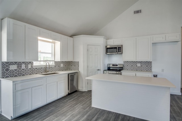 kitchen with white cabinetry, appliances with stainless steel finishes, light countertops, and a sink