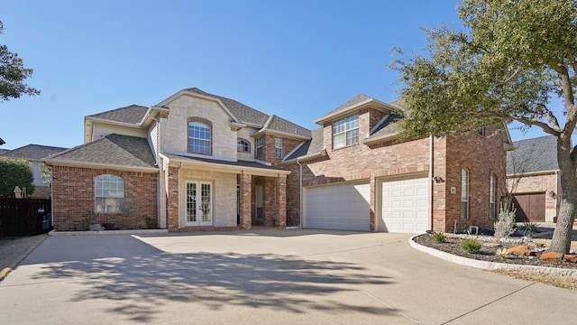 view of front of property featuring a garage, concrete driveway, brick siding, and a shingled roof