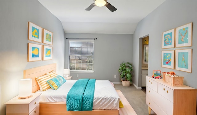 bedroom with vaulted ceiling, baseboards, a ceiling fan, and light colored carpet