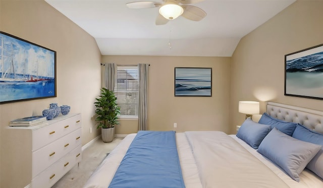 bedroom featuring a ceiling fan, vaulted ceiling, and baseboards