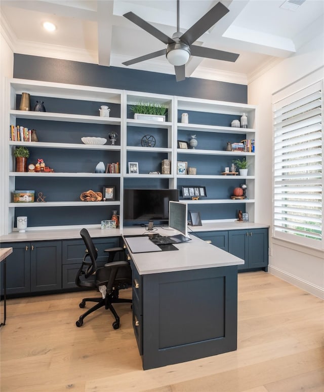 home office featuring ornamental molding, light wood-type flooring, built in desk, and a ceiling fan