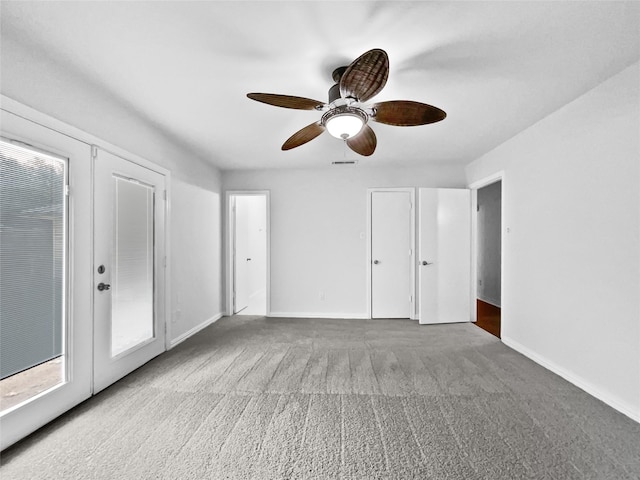 interior space featuring french doors, light colored carpet, visible vents, and baseboards