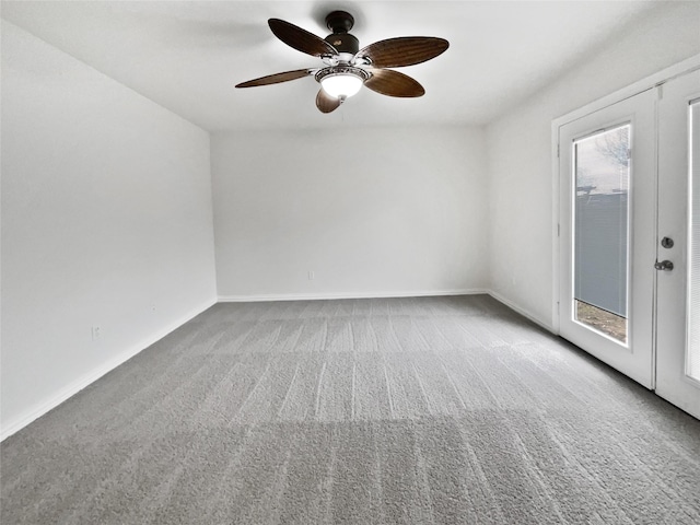 unfurnished room featuring carpet floors, french doors, ceiling fan, and baseboards