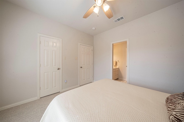 bedroom with baseboards, visible vents, a ceiling fan, and light colored carpet