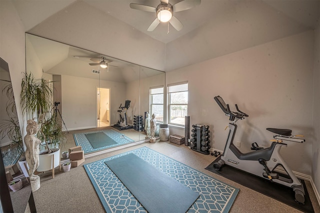 exercise area featuring baseboards, visible vents, a ceiling fan, lofted ceiling, and carpet flooring