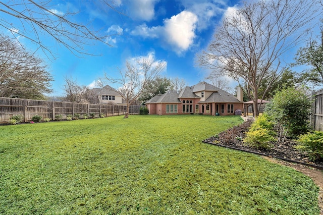 view of yard with a fenced backyard