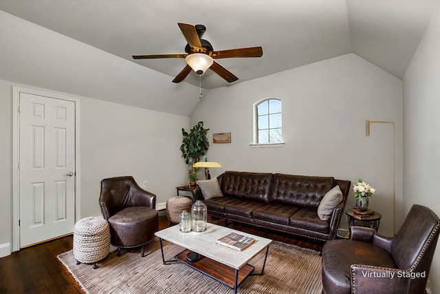 living area featuring vaulted ceiling, wood-type flooring, and ceiling fan