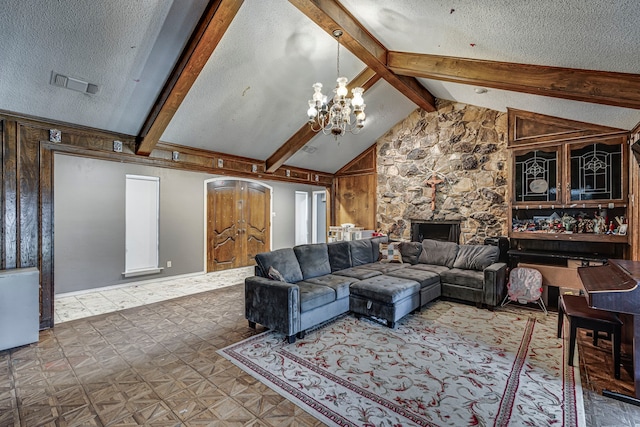 living room featuring a chandelier, visible vents, a textured ceiling, and lofted ceiling with beams