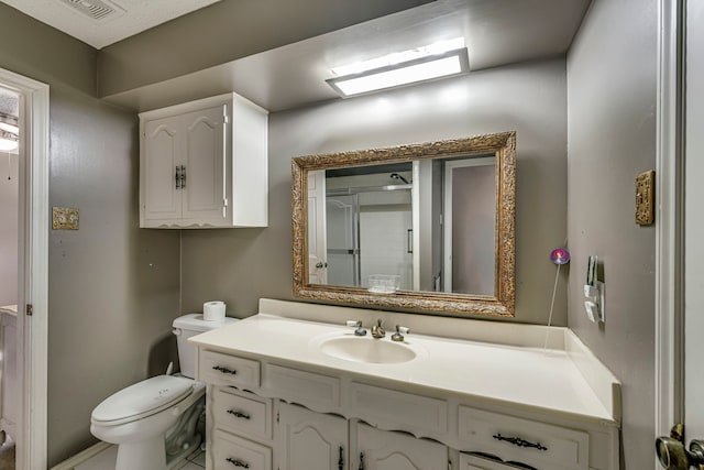 full bath featuring visible vents, vanity, and toilet