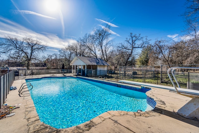 view of swimming pool with fence and a fenced in pool