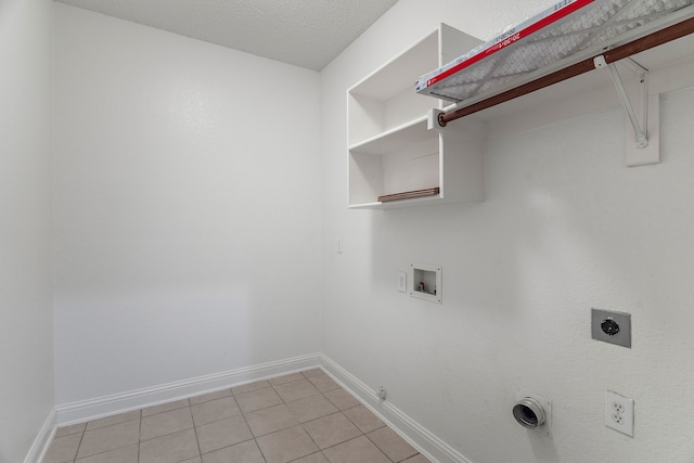 laundry area with laundry area, baseboards, hookup for a gas dryer, hookup for a washing machine, and hookup for an electric dryer