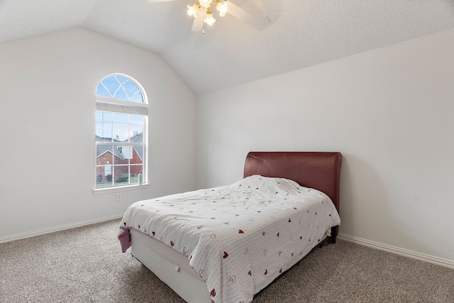 carpeted bedroom with vaulted ceiling, multiple windows, and baseboards