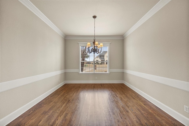 unfurnished dining area featuring ornamental molding, dark wood finished floors, baseboards, and an inviting chandelier