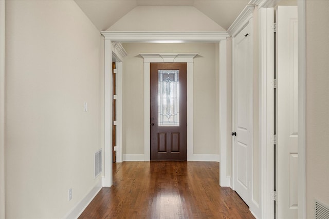 foyer entrance with lofted ceiling, baseboards, visible vents, and dark wood finished floors