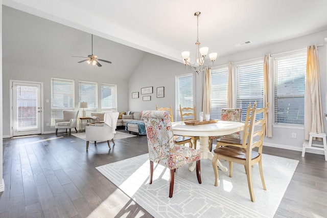 dining room featuring dark wood-style flooring, lofted ceiling, visible vents, baseboards, and ceiling fan with notable chandelier