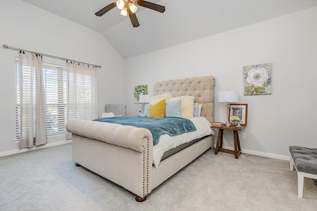 bedroom with ceiling fan, carpet, baseboards, and vaulted ceiling