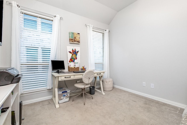 office area with lofted ceiling, light carpet, and baseboards