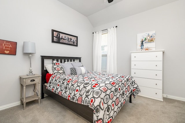 bedroom featuring a ceiling fan, light carpet, vaulted ceiling, and baseboards