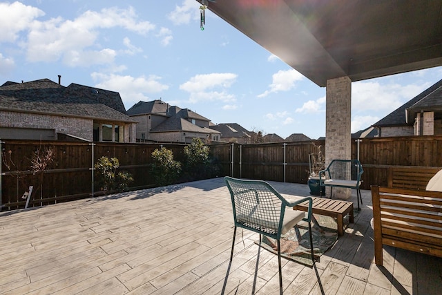 view of patio with an outdoor living space, a fenced backyard, and a residential view