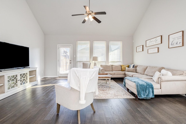 living room with dark wood-style floors, plenty of natural light, high vaulted ceiling, and a ceiling fan