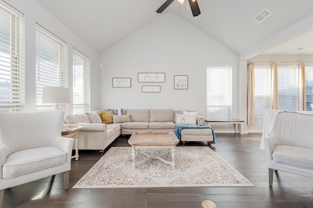 living area with vaulted ceiling, visible vents, dark wood finished floors, and ceiling fan