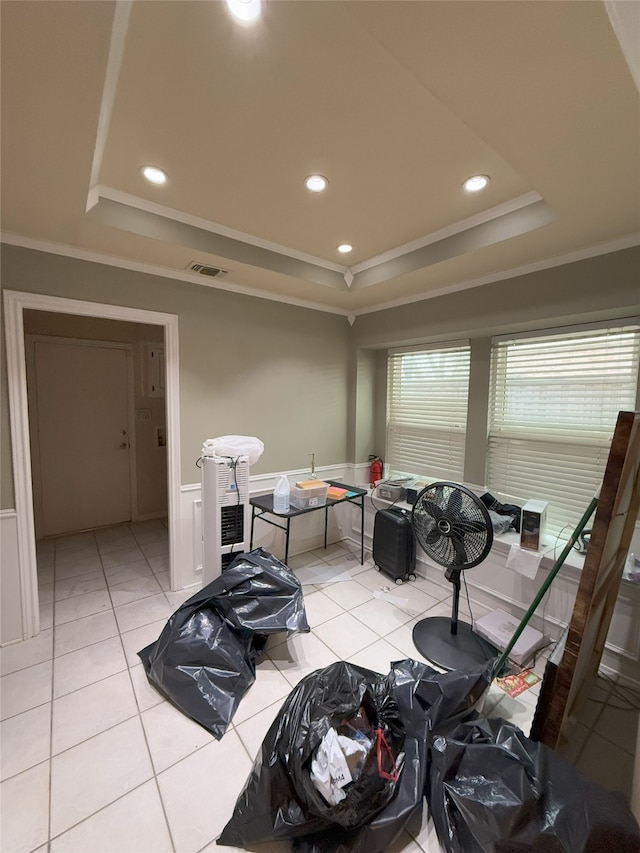 misc room with crown molding, light tile patterned floors, recessed lighting, a raised ceiling, and wainscoting