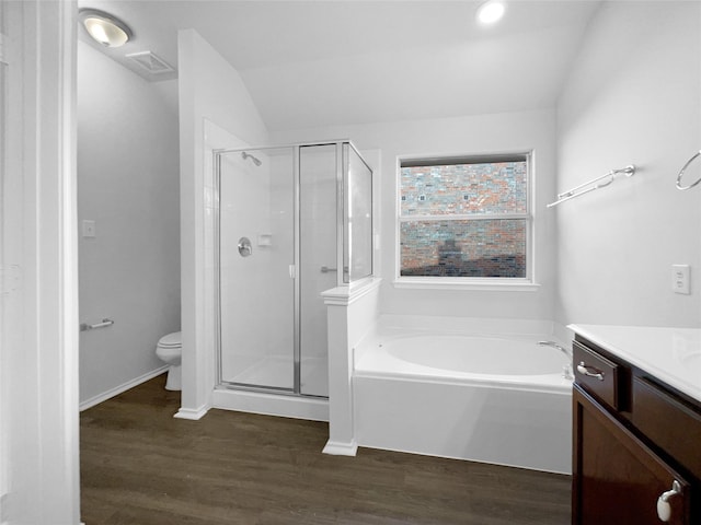 full bath featuring toilet, a stall shower, vanity, wood finished floors, and a bath