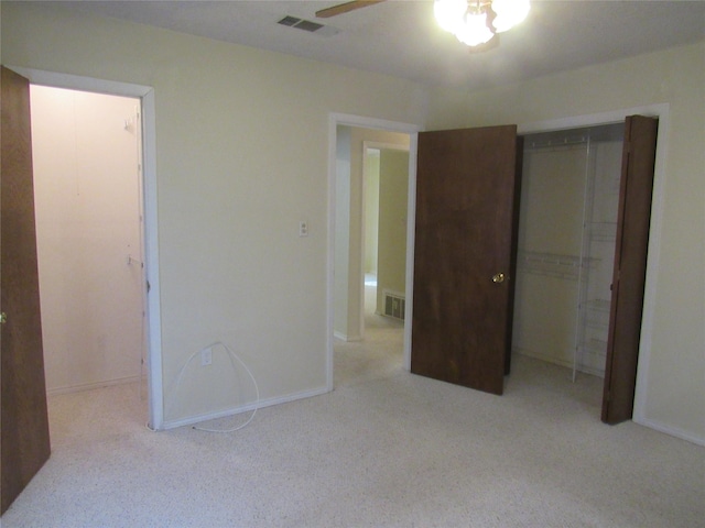 unfurnished bedroom with baseboards, a closet, visible vents, and light colored carpet