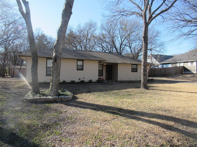 view of front of property with fence and a front yard