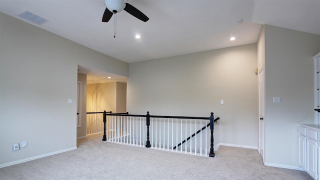 unfurnished room featuring recessed lighting, visible vents, light carpet, and baseboards