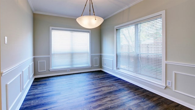 unfurnished room with dark wood-style floors, a decorative wall, and crown molding