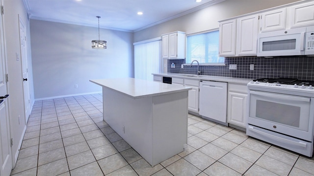 kitchen with white cabinets, white appliances, a kitchen island, and light countertops