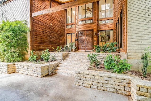 property entrance with brick siding