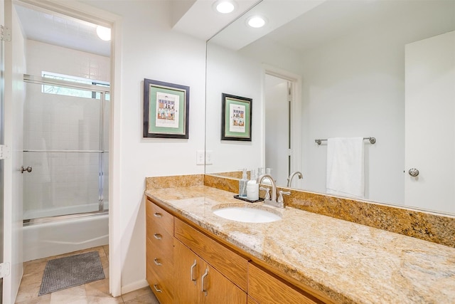 full bath with recessed lighting, enclosed tub / shower combo, vanity, baseboards, and tile patterned floors