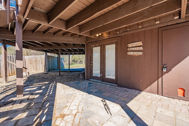 view of patio featuring fence