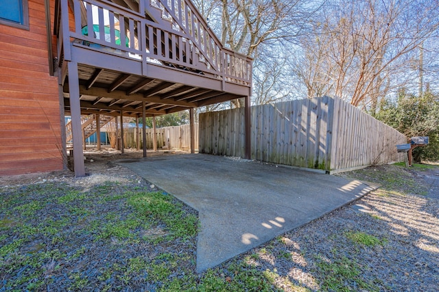 exterior space featuring stairs and a fenced backyard