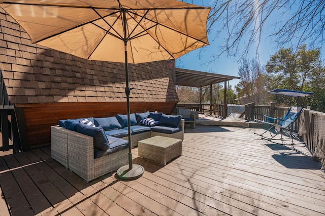 wooden terrace featuring an outdoor hangout area