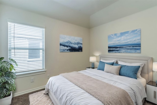 carpeted bedroom with baseboards