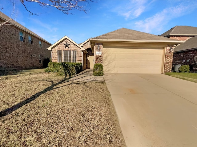 ranch-style home with a garage, brick siding, and driveway