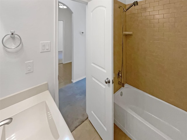 full bath featuring shower / washtub combination and a sink